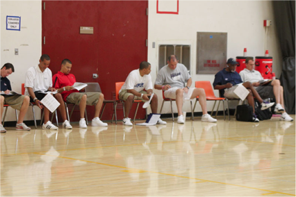 College recruiters at the Adidas Three Stripes tournament in LA scope out the courts for outstanding players.