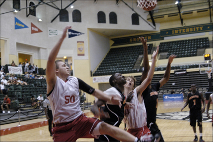 Tony Fabiano (#50) and Austin Cooke (#31), sophomores, holding off graduated seniors.